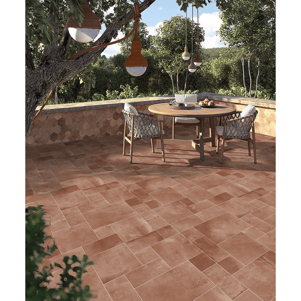 Outdoor dining area featuring Terracotta Cotto Glazed Porcelain tiles in a warm, earthy tone with a natural matte finish.