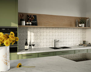 kitchen design with white star and cross splashback. There is a yellow flower in a pot on the counter.