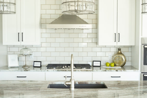 all white colour kitchen design with subway tiles on the splashback.