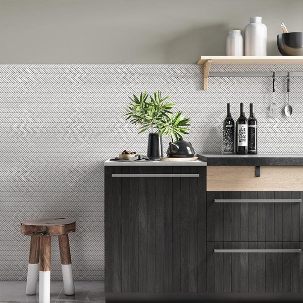 a simple kitchen design with black and brown cabinet and white porcelain tiles laid in herringbone style