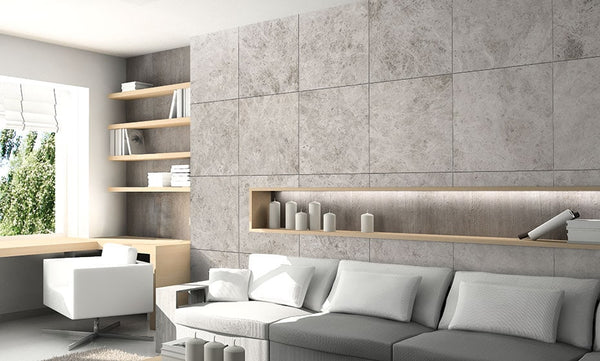 modern interior design with grey marble on the walls and white and grey sofas