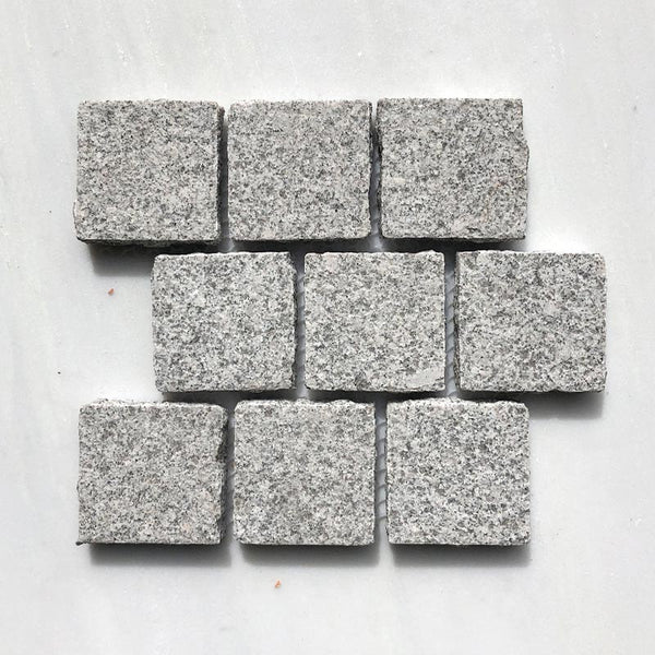 SESAME WHITE BUSH HAMMERED COBBLESTONE GRANITE BRICK PATTERN